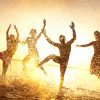 Group,Of,Happy,Young,People,Dancing,And,Spraying,At,The